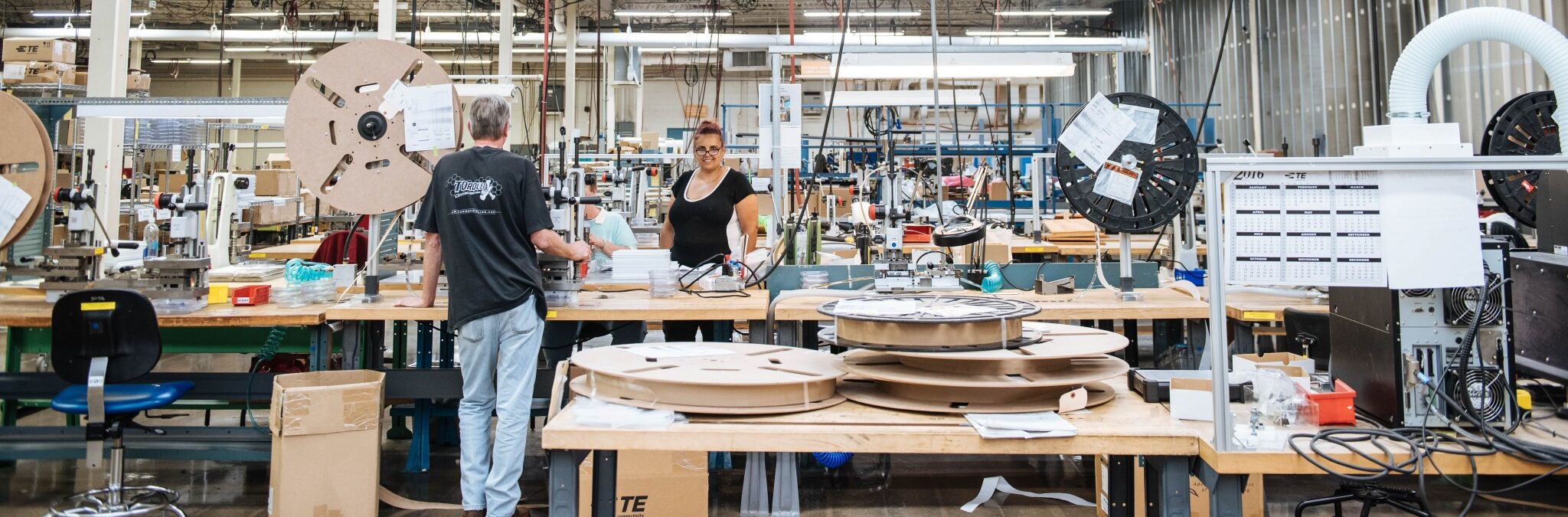staff working together in a large workshop